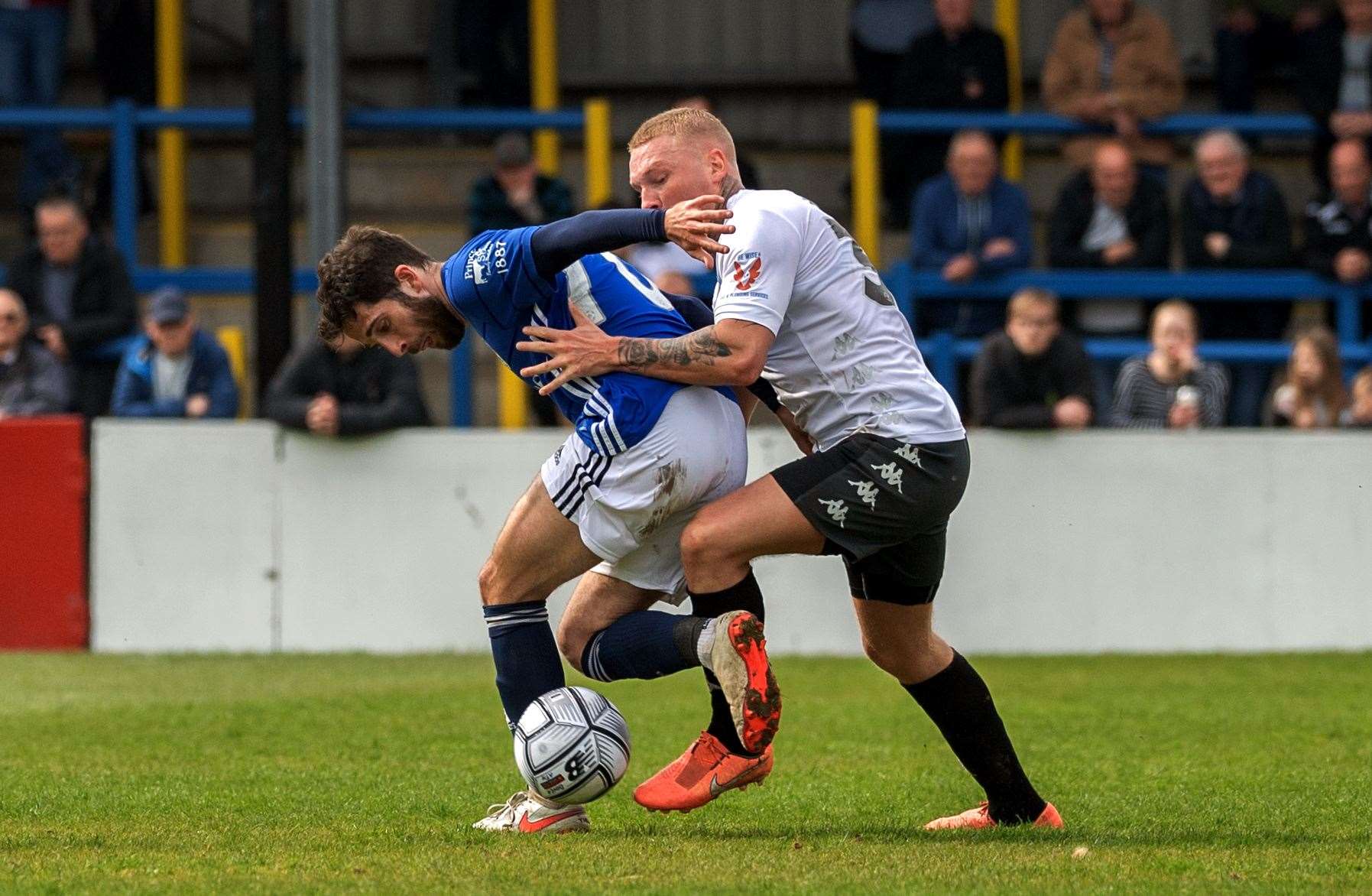 Dover's Myles Judd battles for the ball. Picture: Stuart Brock