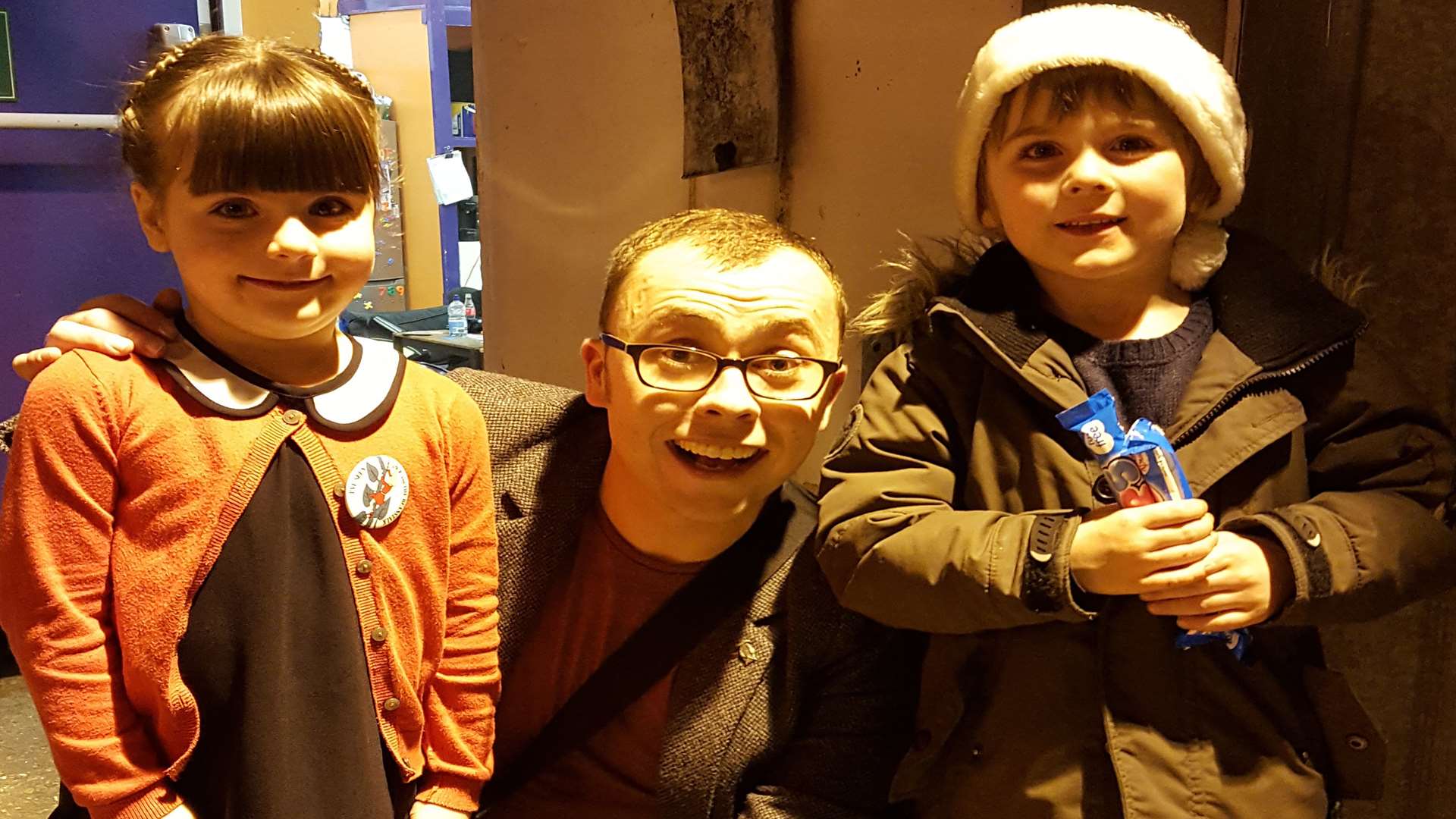 Poppy and Jude, both five, with Joe Tracini who plays Simple Simon