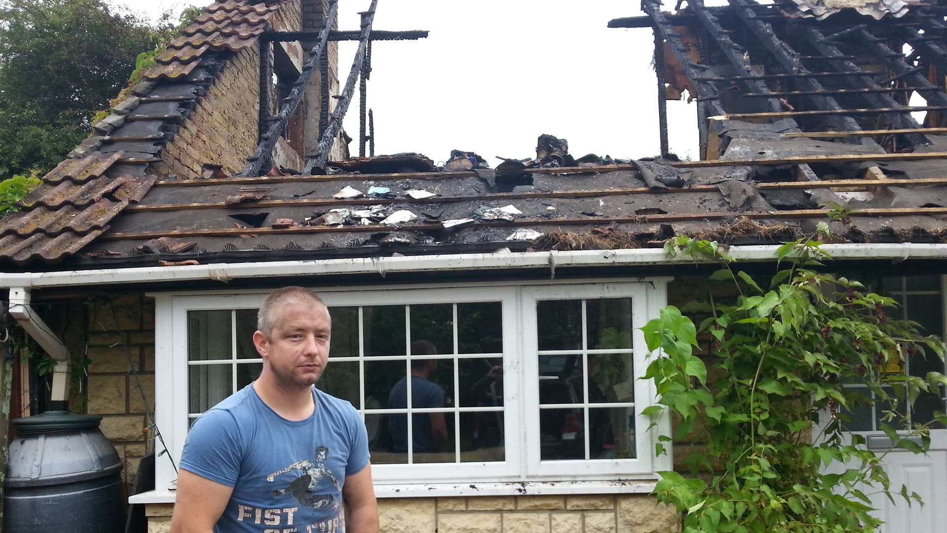 Ian Reynolds outside his parents' home