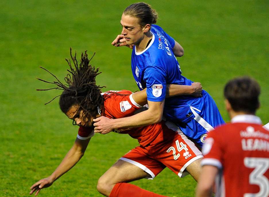 Gillingham striker Tom Eaves challenges for the ball Picture: Ady Kerry