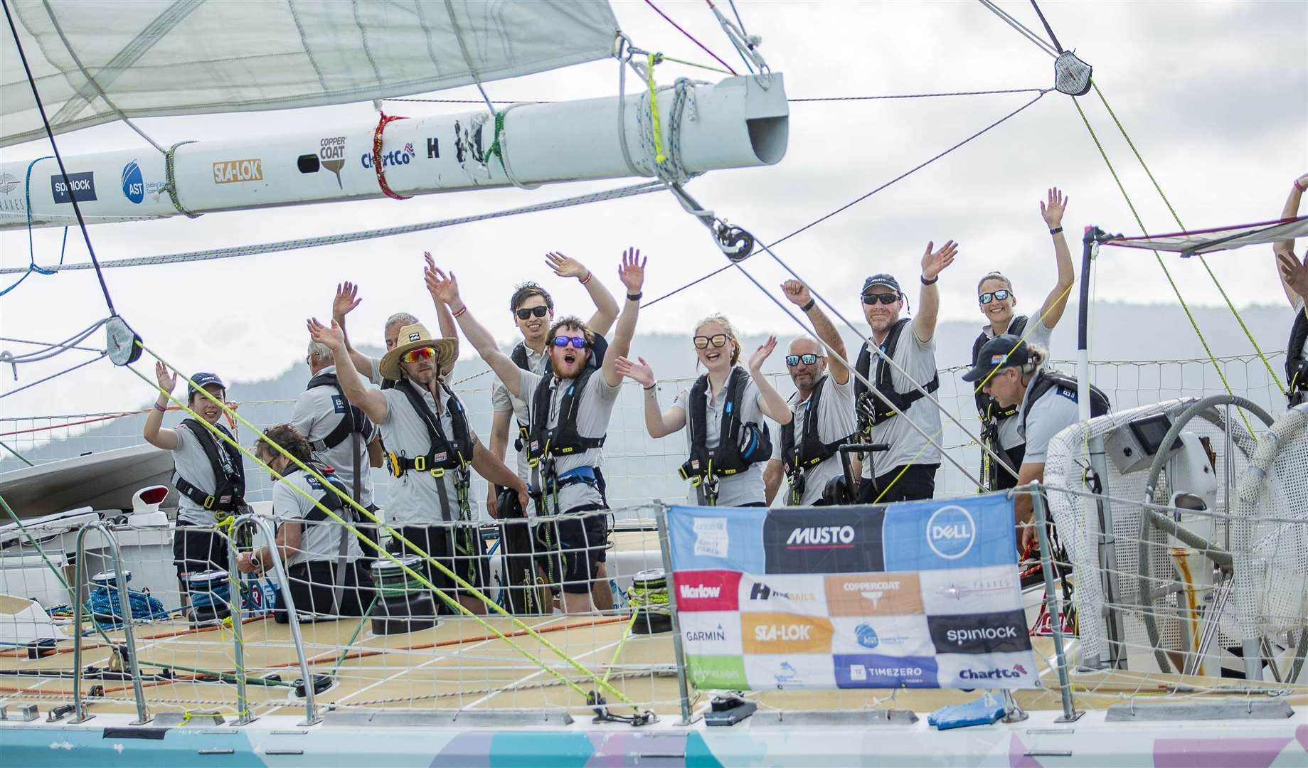 Ellen (centre) and her teammates cross the finish line