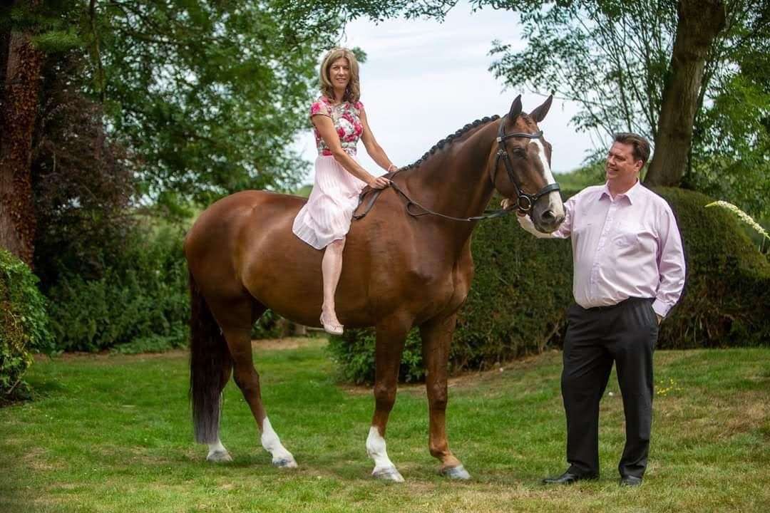 Rachel Collins and her new husband Roger Taylor with guest of honour, Muddy