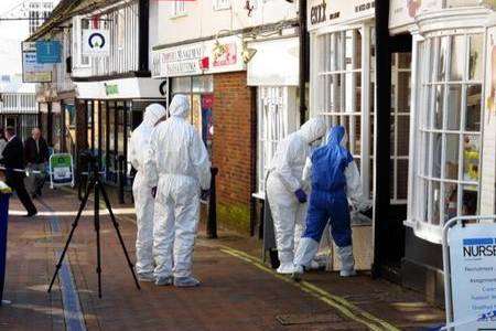 Police forensics officers at Esacks Hair and Beauty in Ashford High Street. Picture: Andy Clark