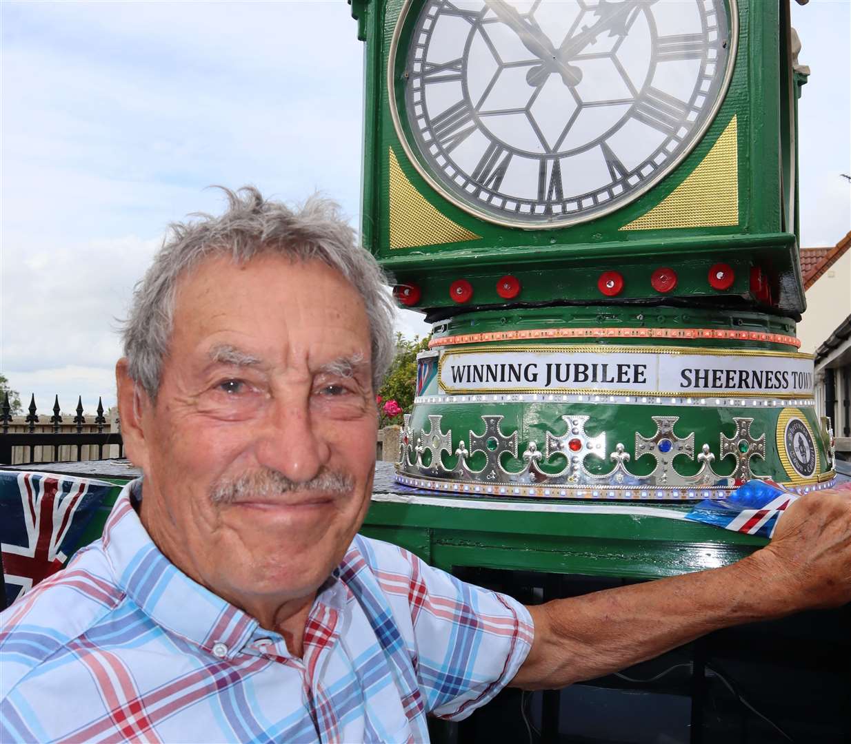 Tim Bell from Minster, Sheppey, and his replica mobility scooter Sheerness clock tower. Picture: John Nurden