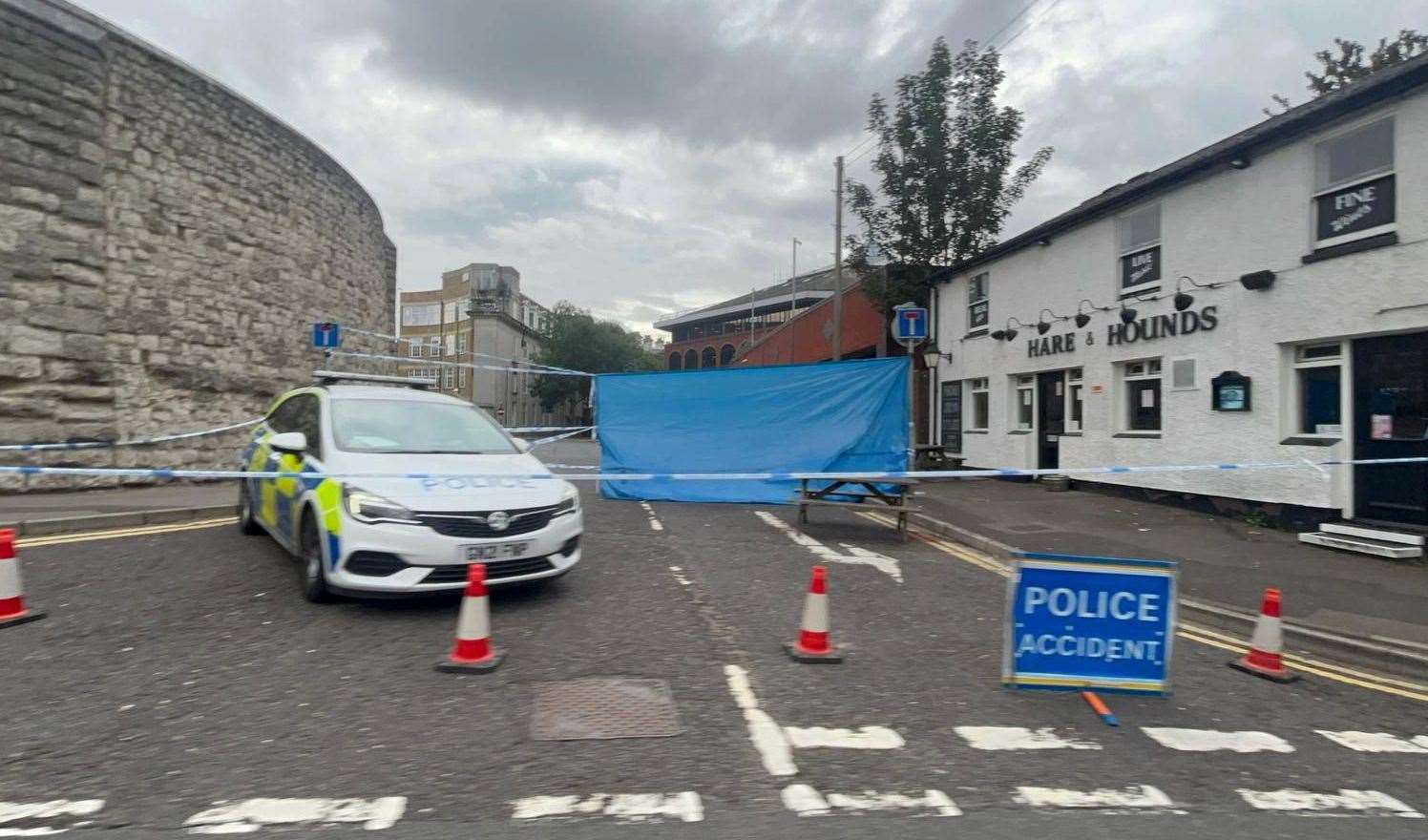 Police remained outside the Hare and Hounds the day after the attack