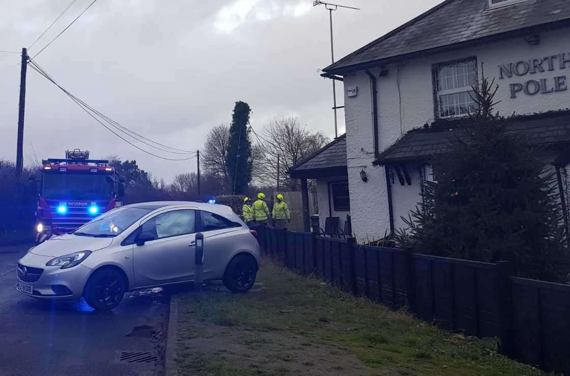 Fire crews outside the North Pole pub in Wateringbury where a two-car collision saw a silver Volvo crashed through the fence and sever a gas pipe