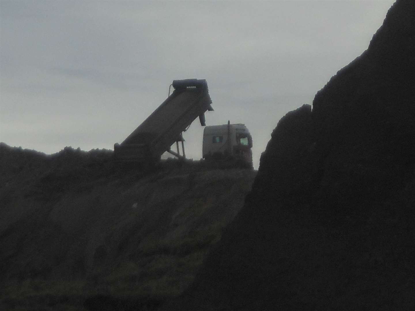 A dump truck tipping its load by Eastchurch Gap. Picture: Daniel Hogburn