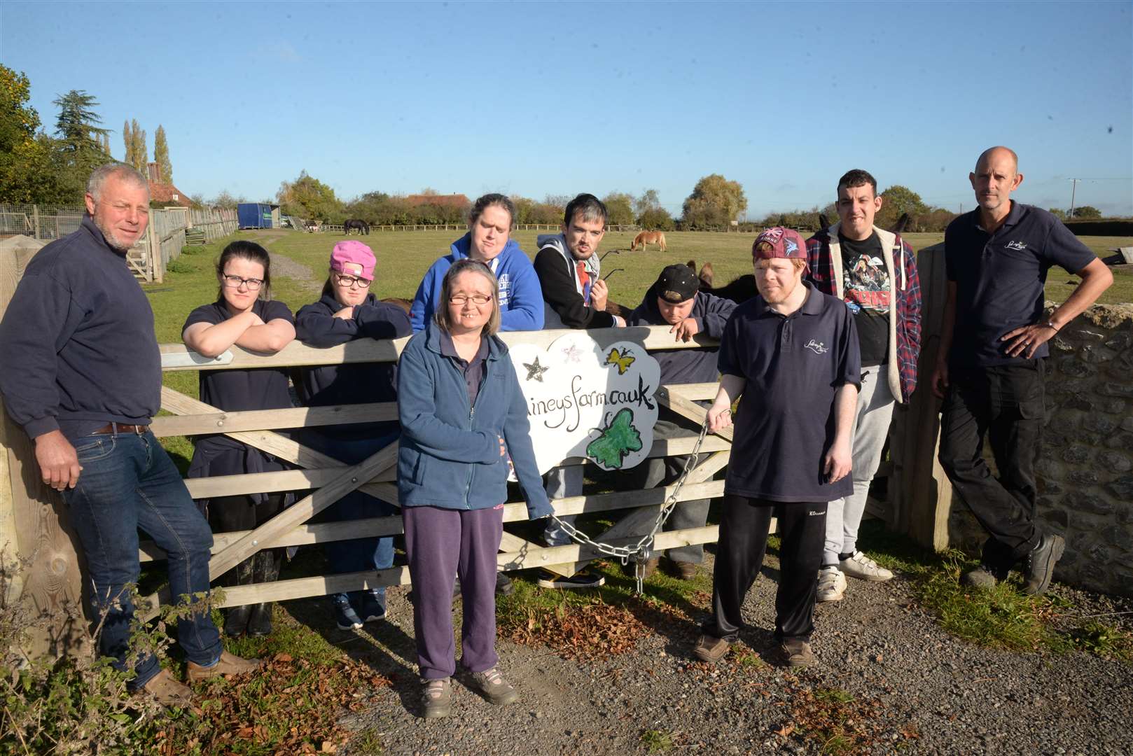 Owner Toby Marsh and care assistant Rafael Dupre with students at Lainey's Farm, Staplehurst who have had their tractor stolen. Picture: Chris Davey... (4991818)