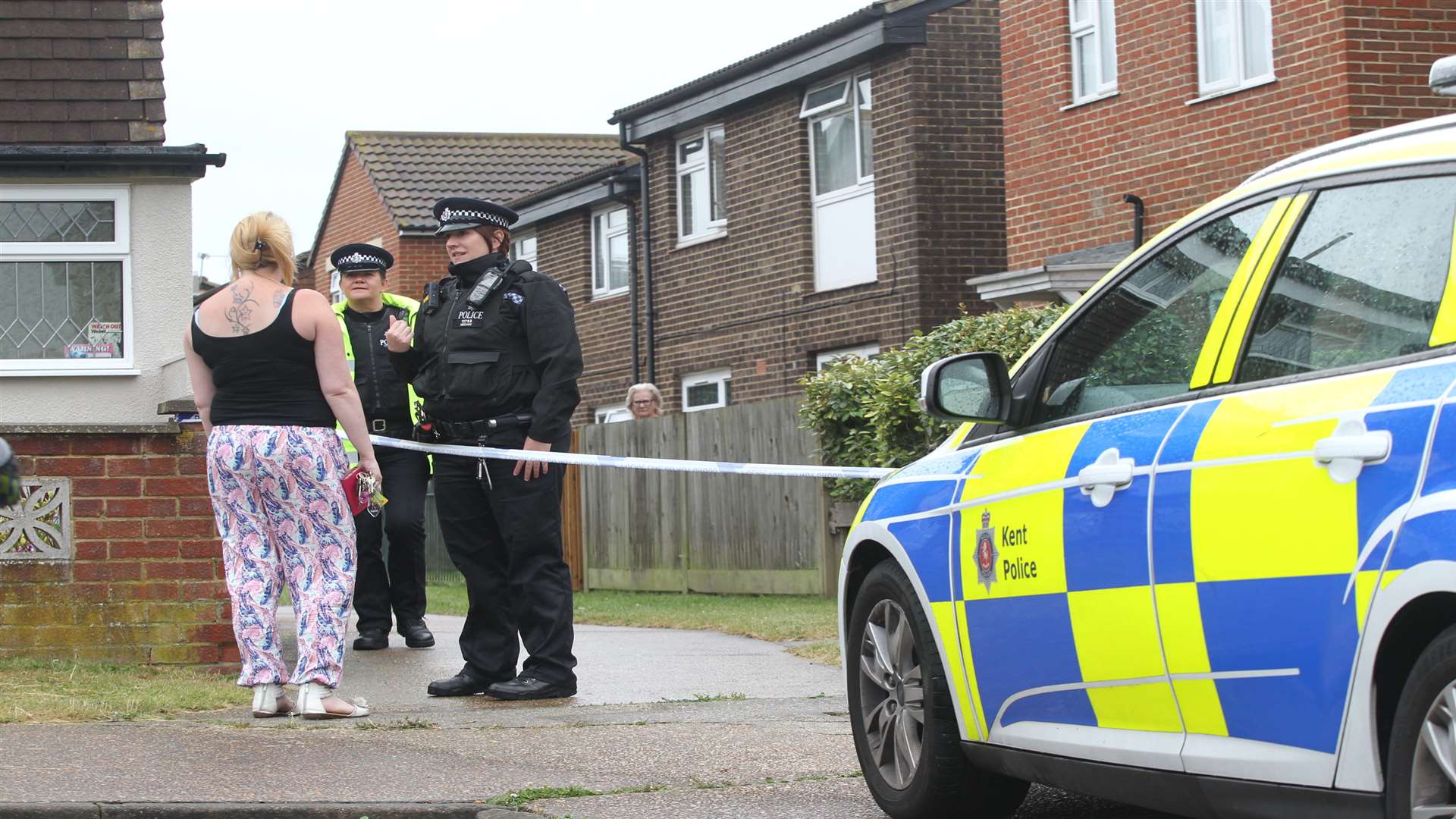 Police in Kinross Close, after the body was found