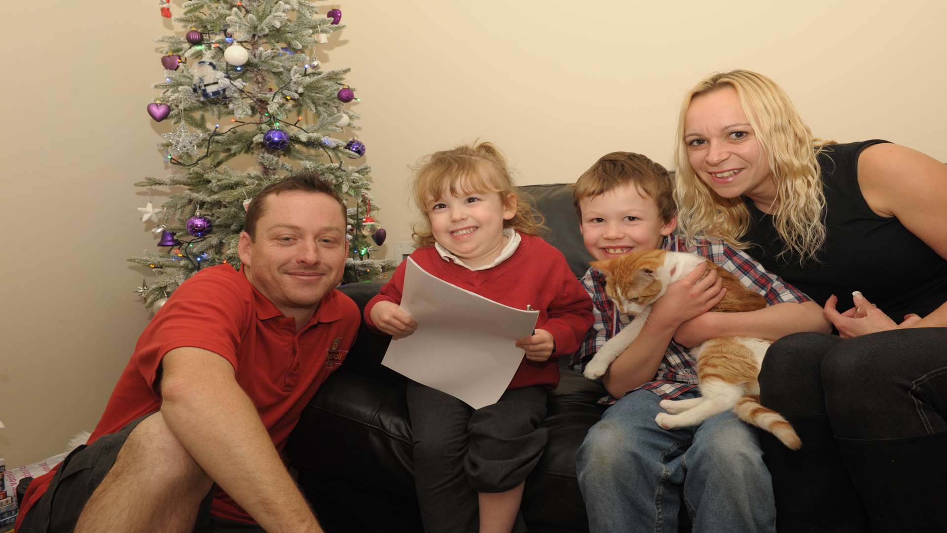 The Stewart family, Julie and David with Paige (4) and Craig (8) and Toffee the cat.