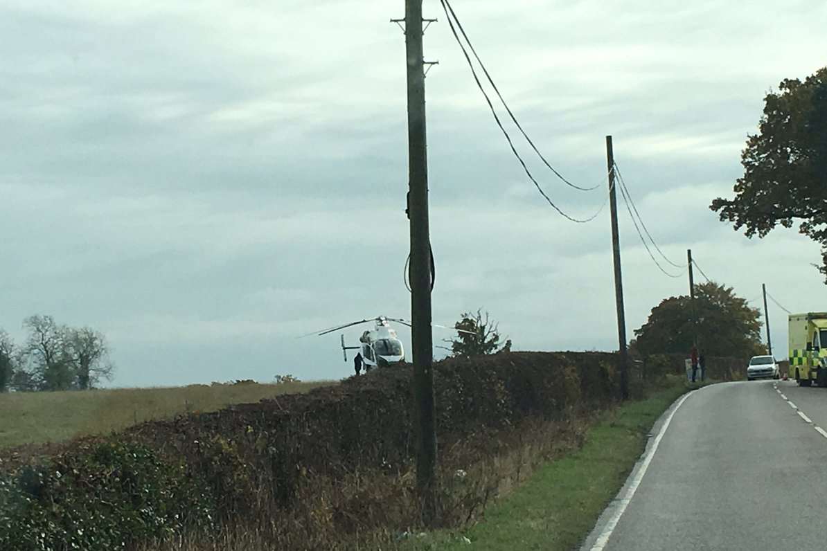 The air ambulance lands at the scene of a traffic accident in Biddenden. Picture Ian Summers