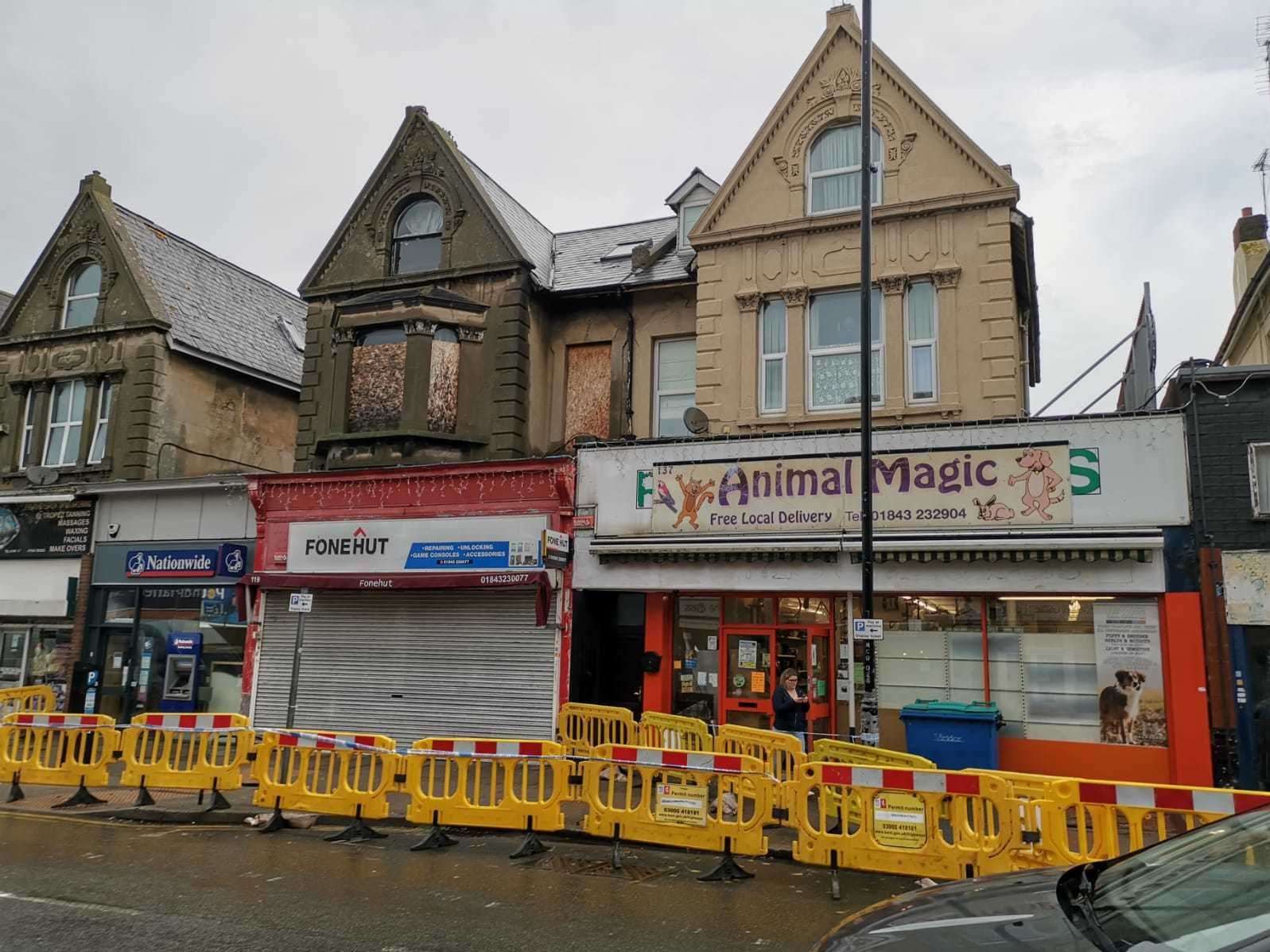 Police tape has been placed around the shop (19616386)