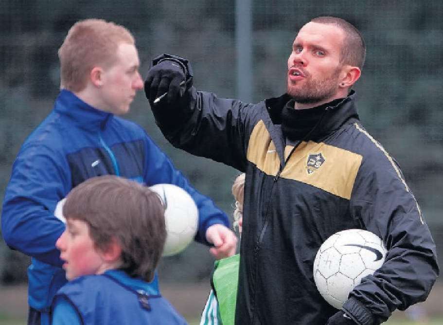 Bromley striker Adam Birchall coaching with the Pro Soccer Academy