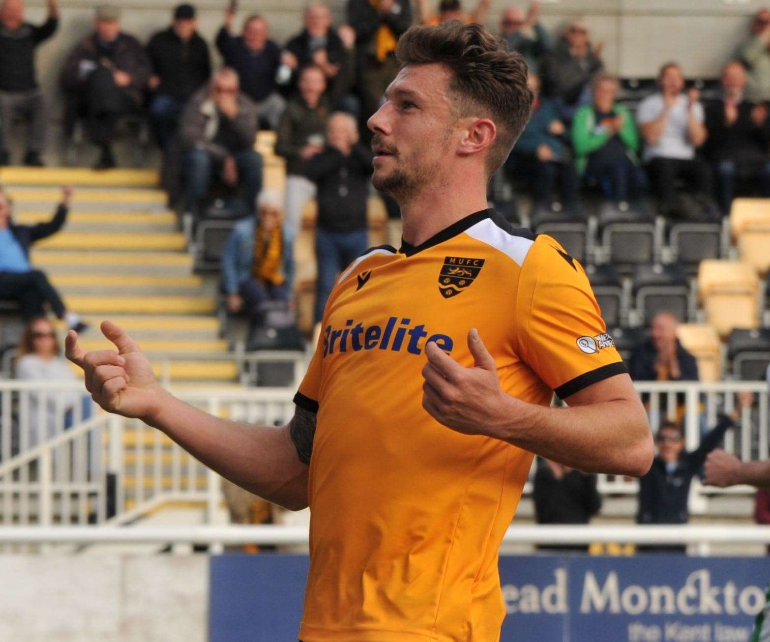 Maidstone striker Matt McClure celebrates his hat-trick goal Picture: Steve Terrell