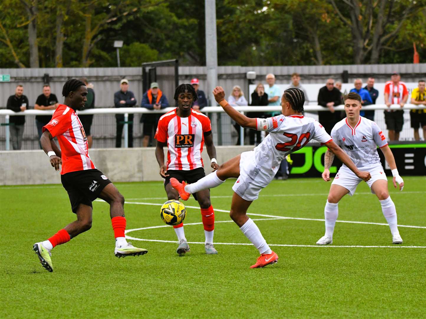 Sheppey United (red) challenge for possession during their FA Trophy tie with Ramsgate at Holm Park last Saturday Picture: Marc Richards