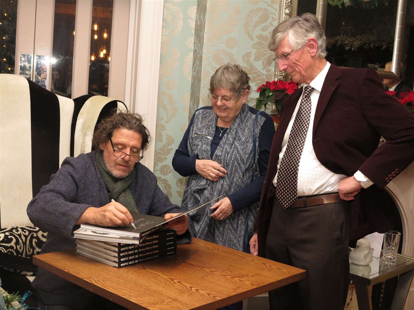 Guests Dilys and Ray Hones have their booke signed by Mr Whtte. Picture: Best Western Plus Dover Marina Hotel and Spa