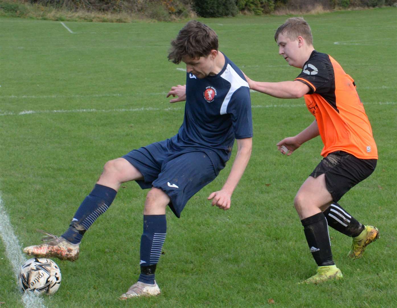 AFC Shorne's Dave Gray holds off Pegusus 81's Kai McNeil on Sunday. Picture: Chris Davey (53210761)