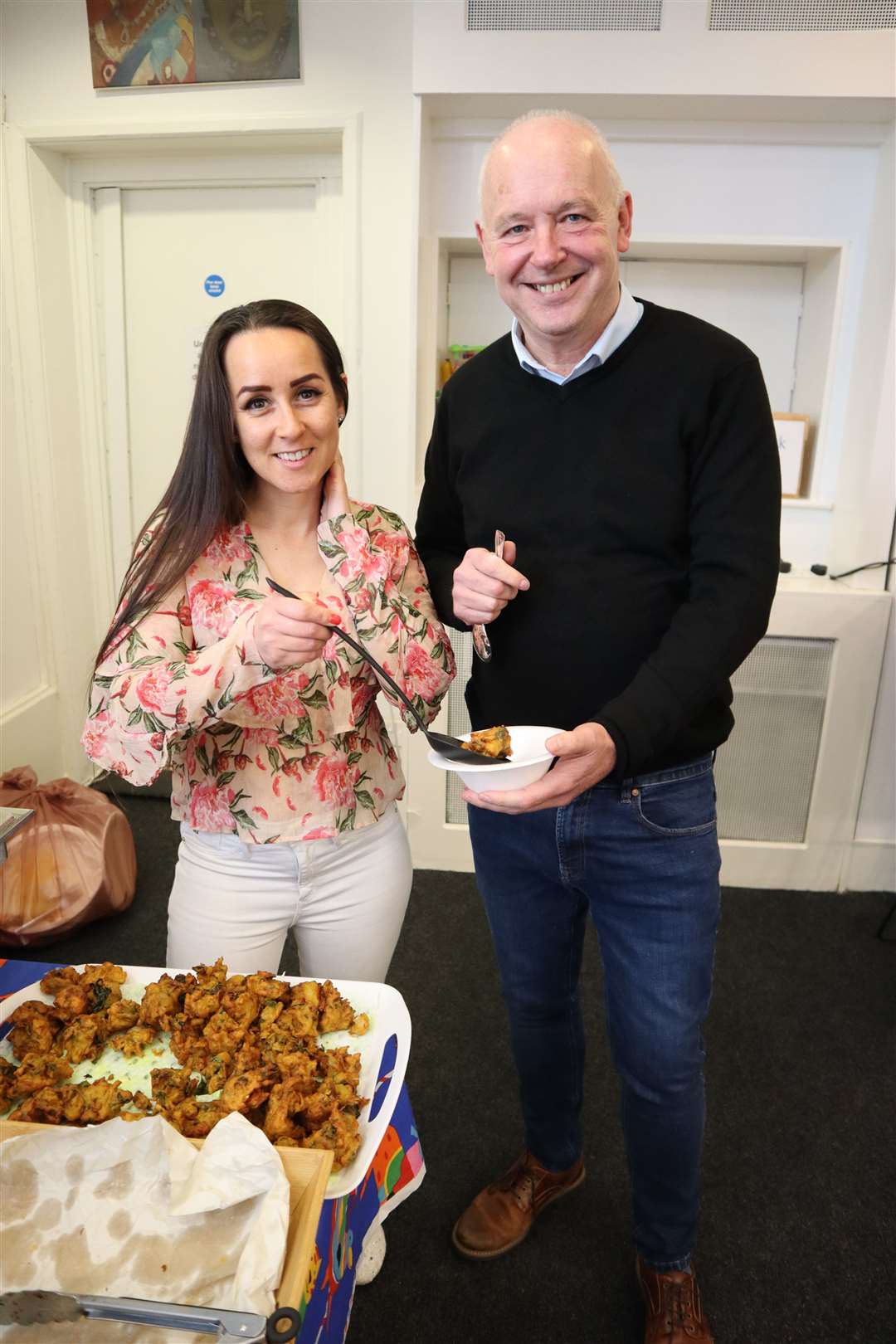 Lily Harber and guest Paul West of the Pyramid Project sample the dishes at Diversity House