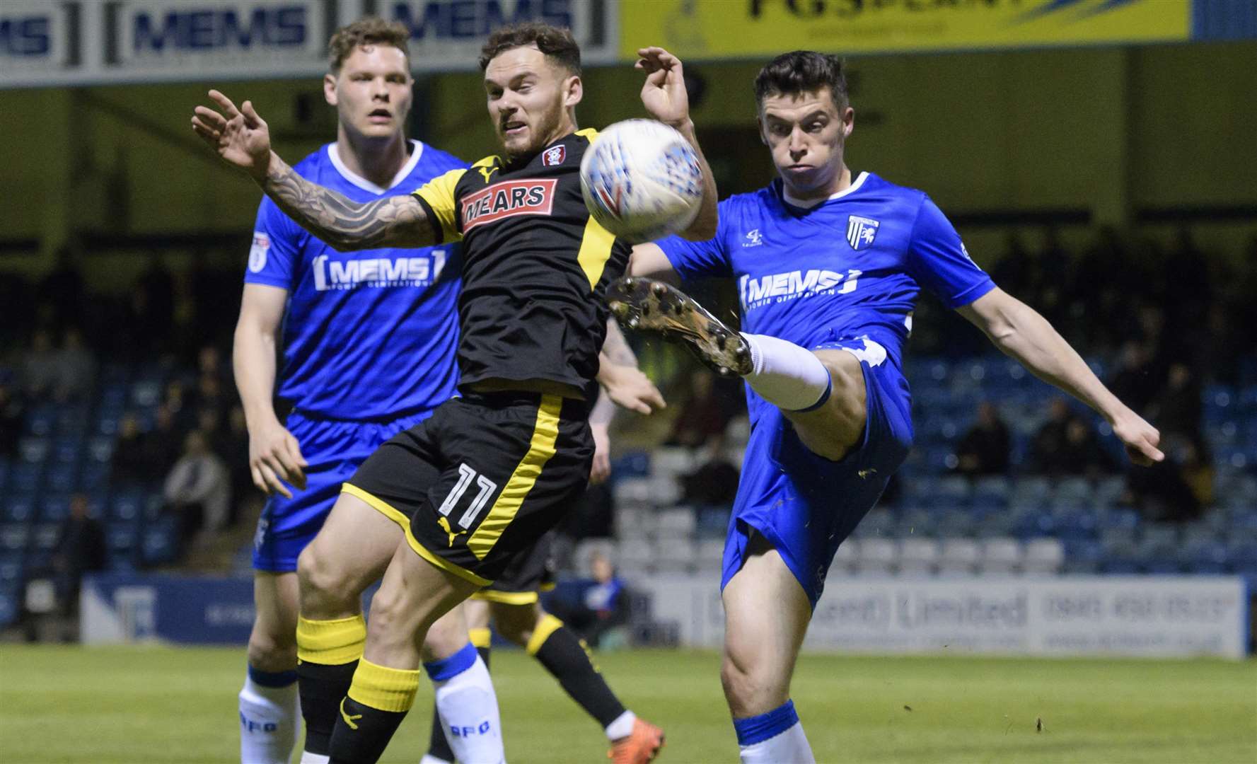 Callum Reilly clears under pressure from Jon Taylor Picture: Andy Payton