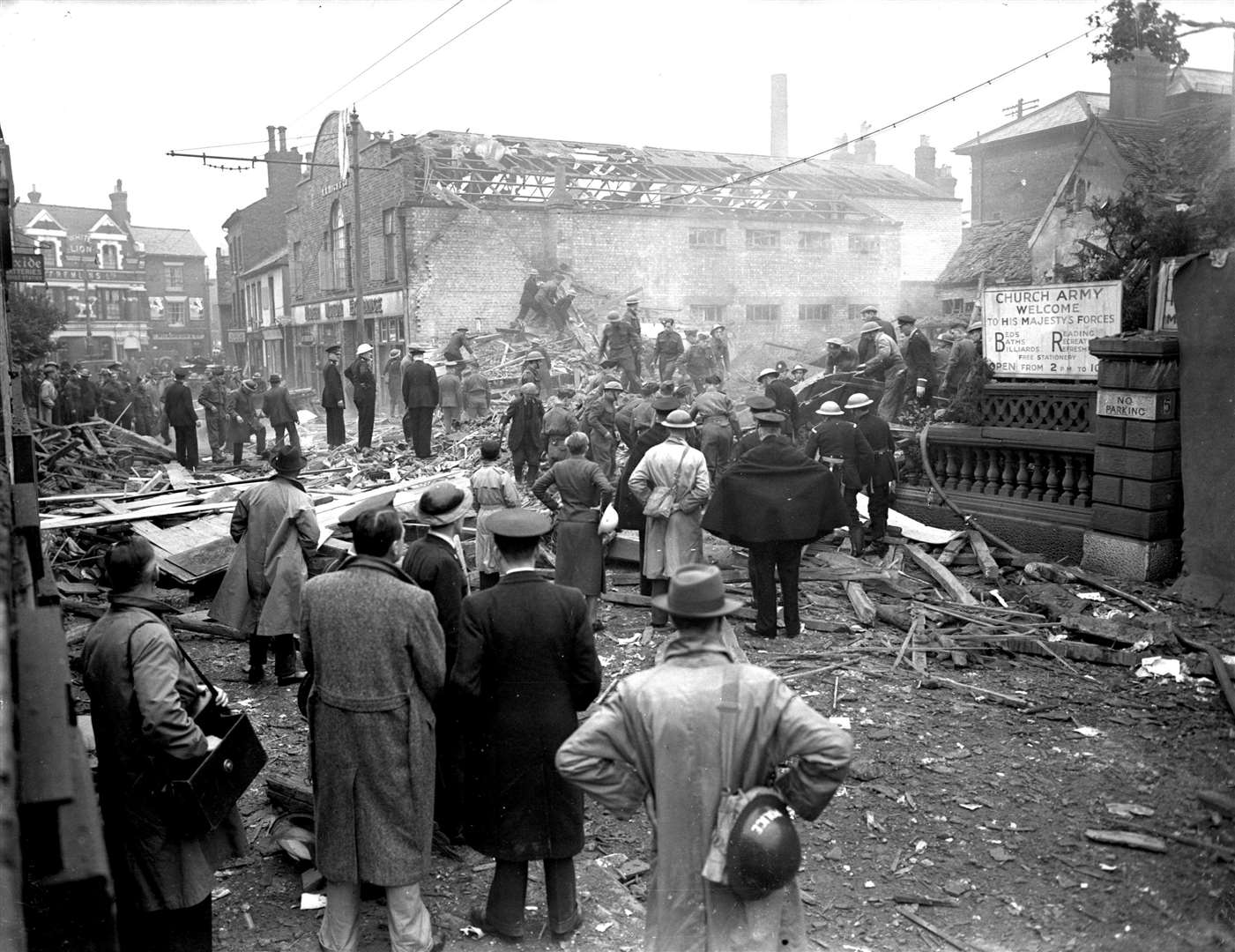 Residents look at the smouldering rubble of the Foresters Arms in Knightrider Street which was destroyed by a German bomb in 1940 Archive picture