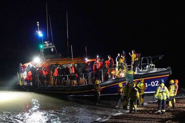 A group of people being helped by an RNLI lifeboat at Dungeness following a small boat incident in the Channel. Picture: Gareth Fuller/PA