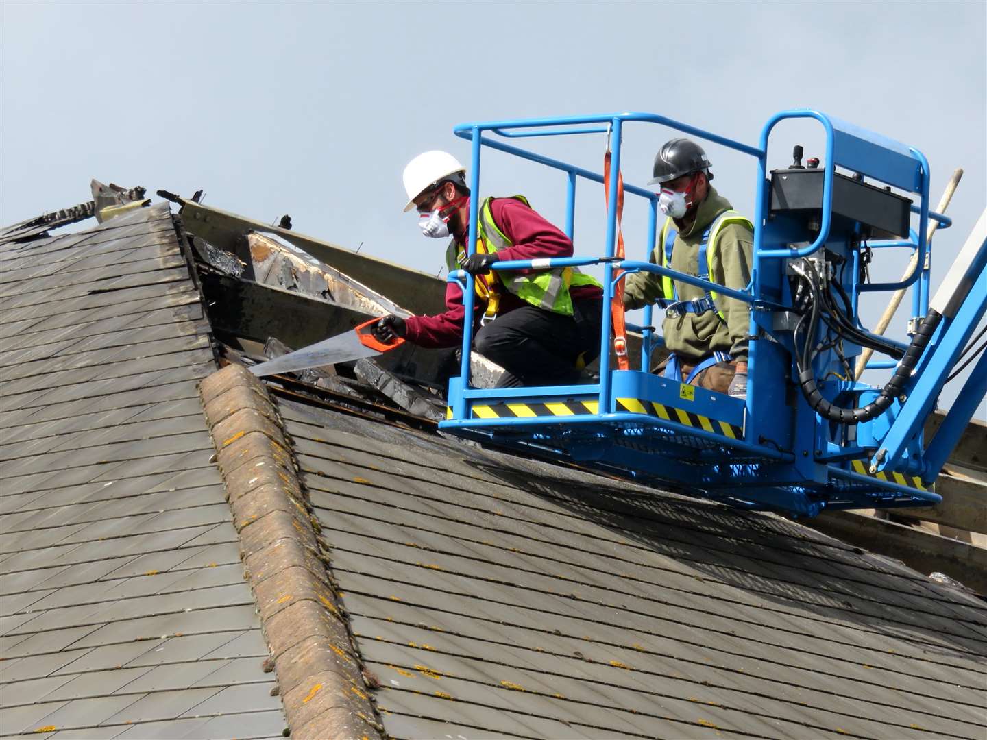 Workmen begin repairs to the fire-damaged Tesco Express store in Mace Lane, Ashford Picture courtesy of Andy Clark