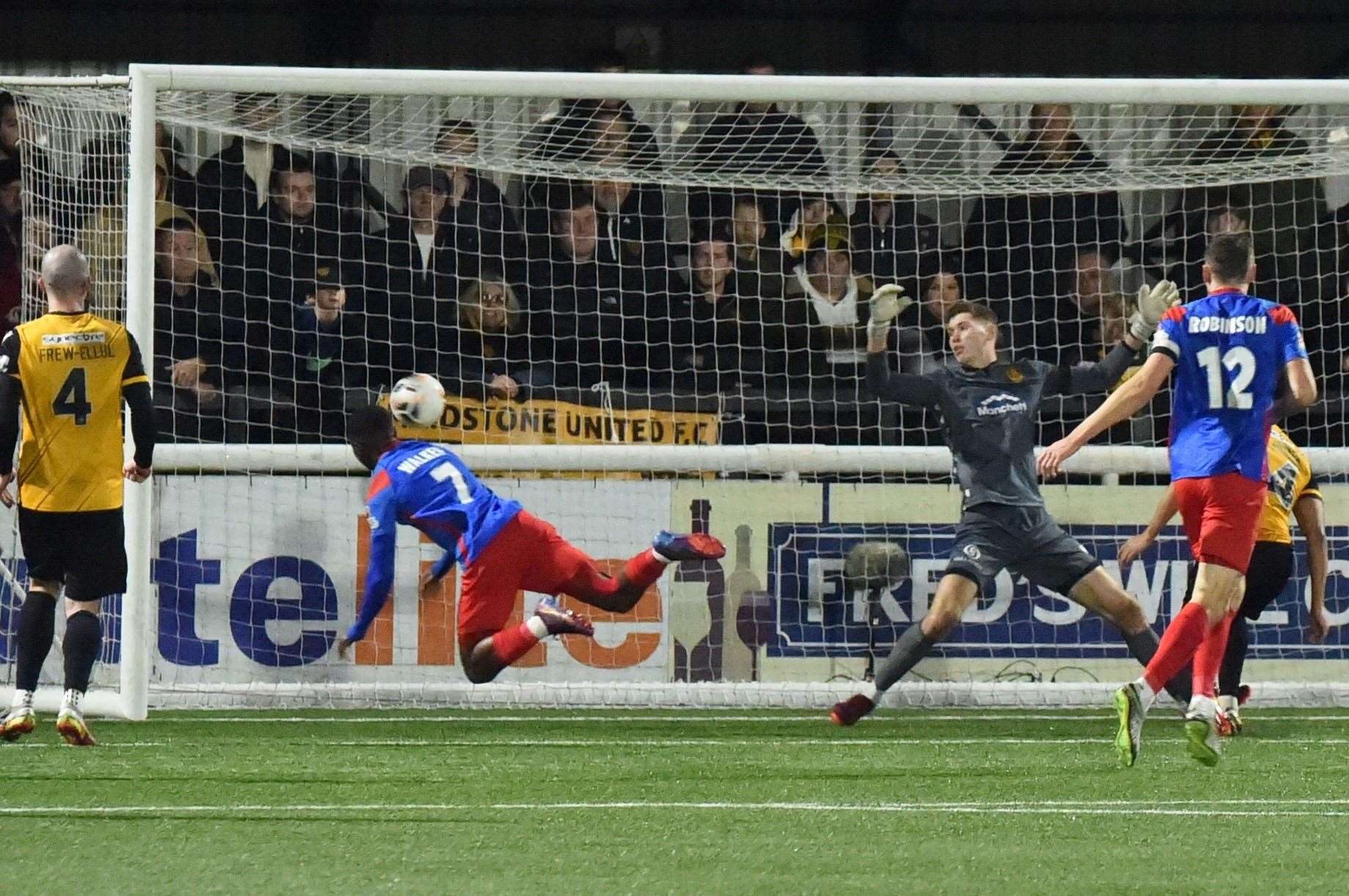 Josh Walker heads home Dagenham's winner at the Gallagher Stadium. Picture: Steve Terrell