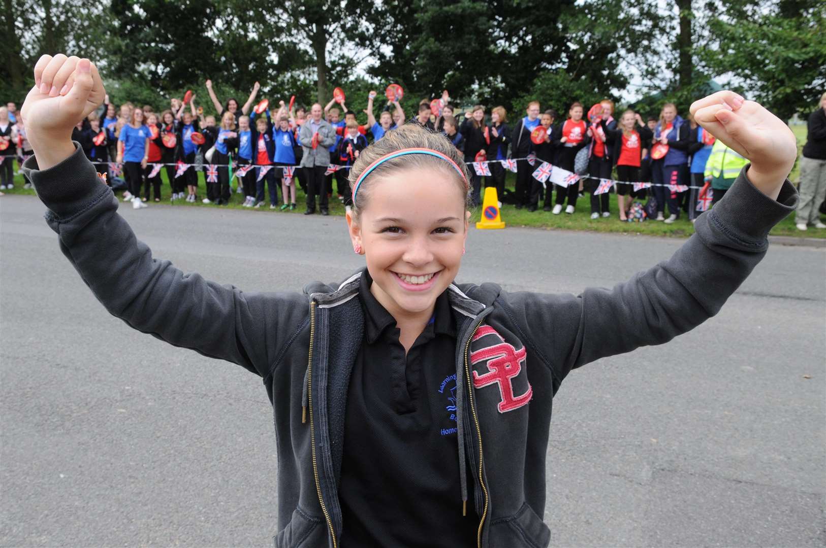 Olympic torch runner Ella Barns with her school friends at Hamstreet