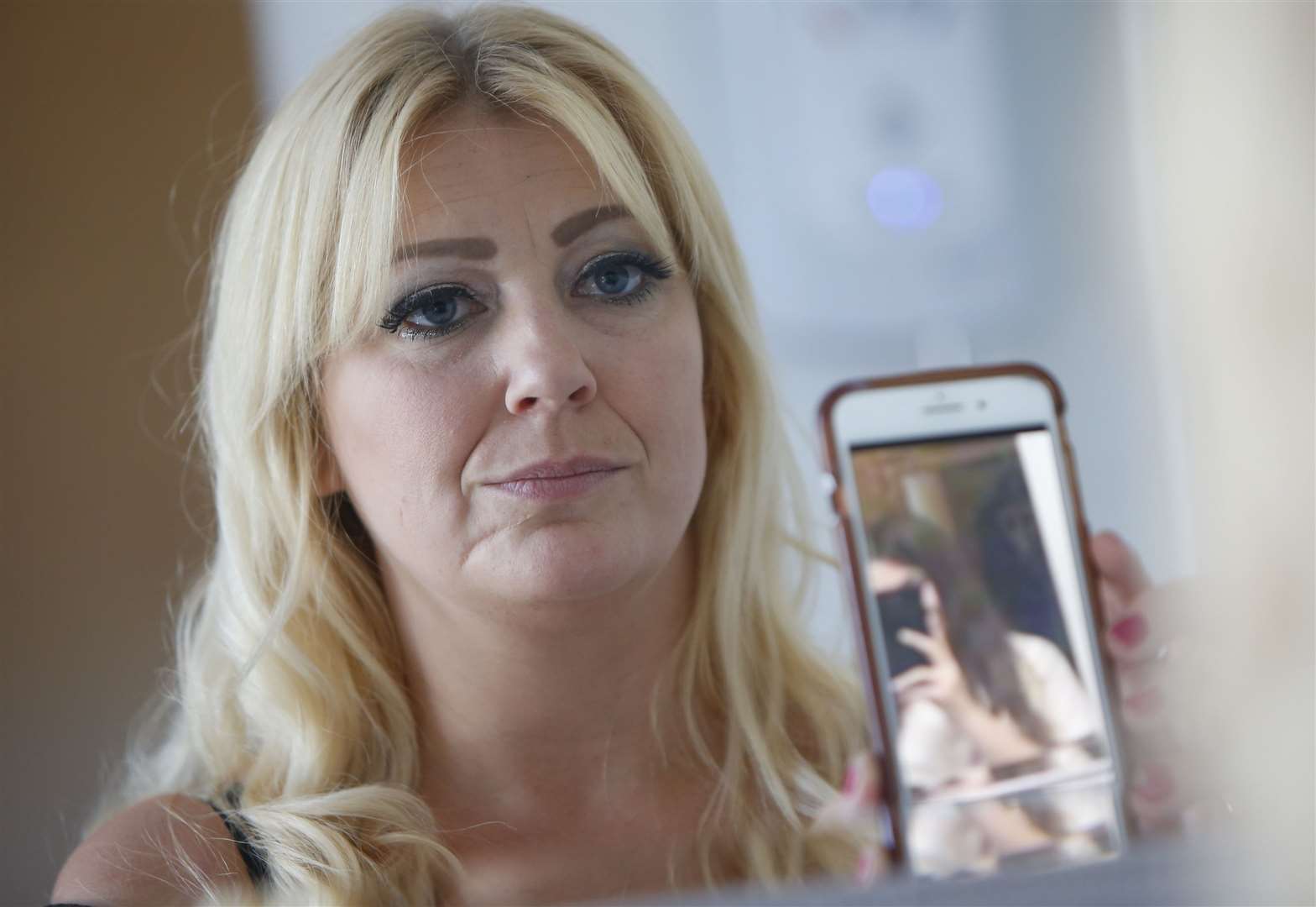 Vikki Booth is convinced her home is haunted after spotting a ghoul in a mirror selfie