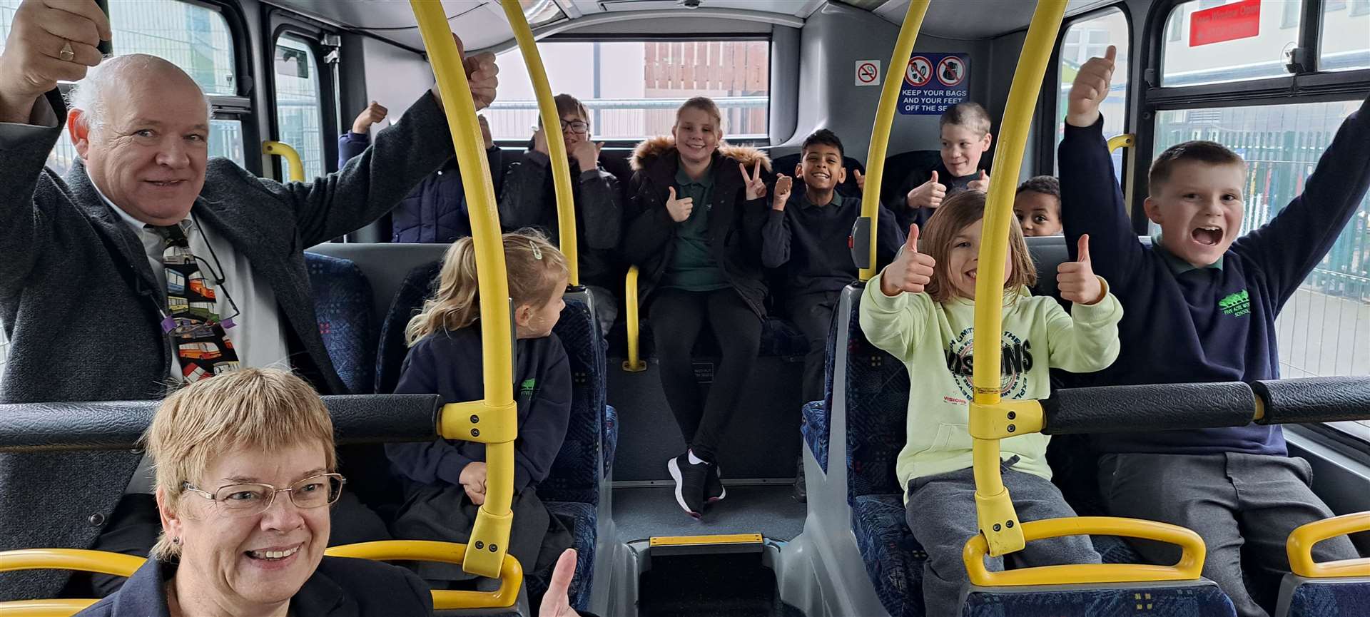 Norman Kemp joins pupils aboard the bus