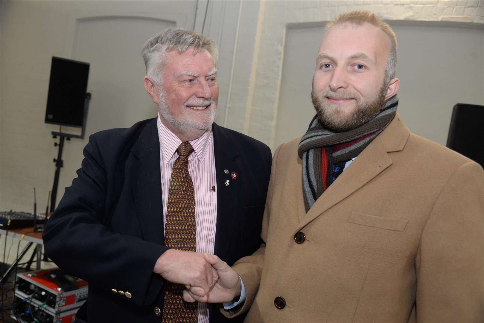 Cllr Ian Thomas congratulates his son Robert after his election at the Canterbury North by-election count gets underway in the Westgate Hall on Friday. Picture: Chris Davey. (5462582)