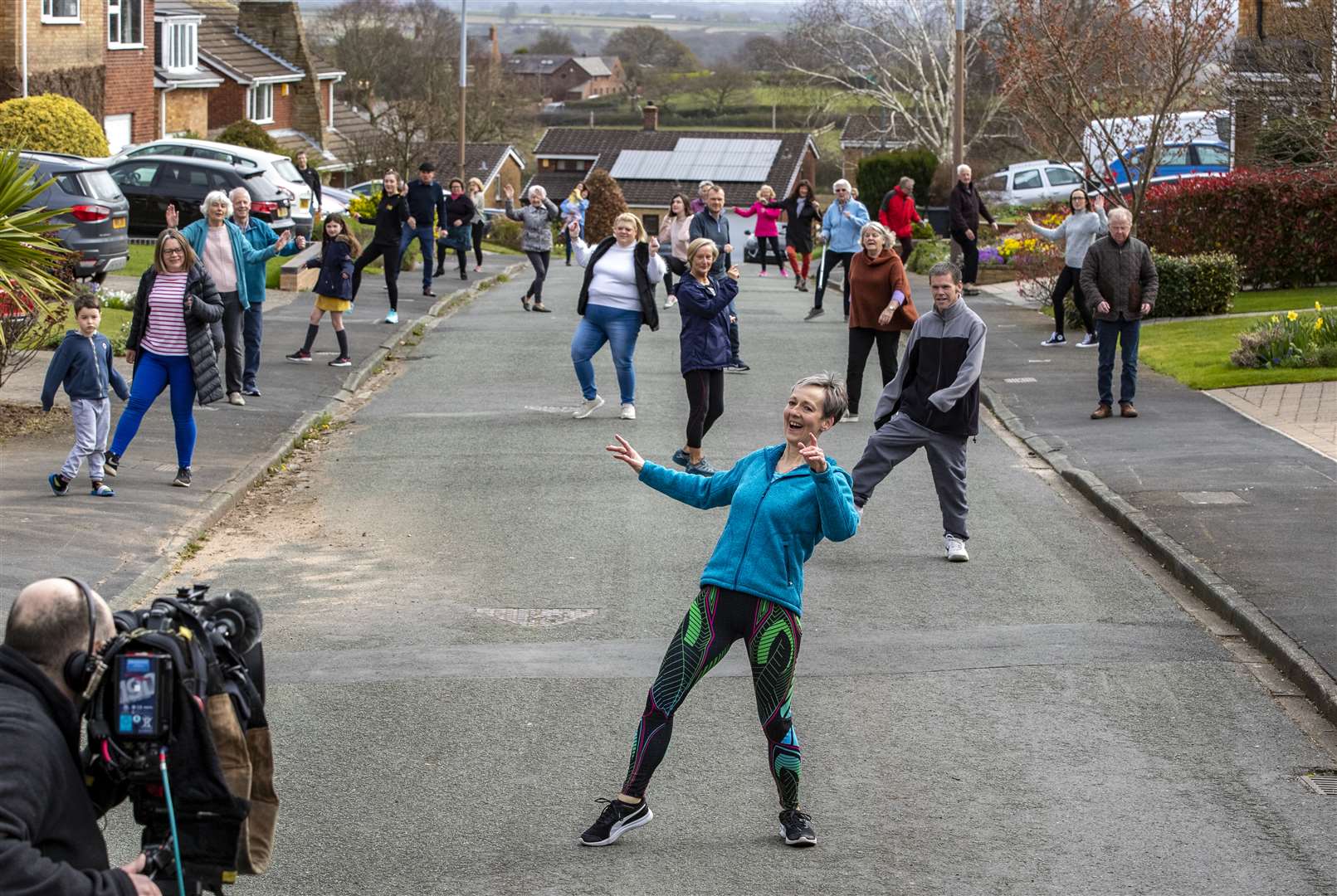 The residents have been turning out for exercise and companionship at a distance (Peter Byrne/PA)