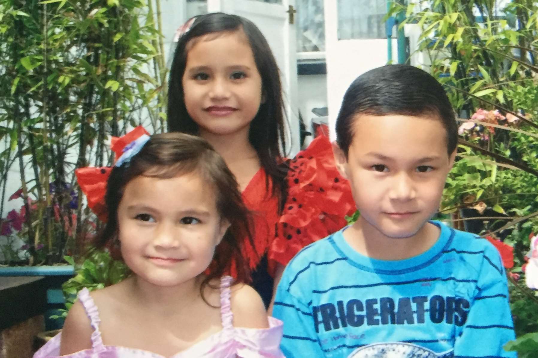 Michael with sisters Victoria and Charlotte