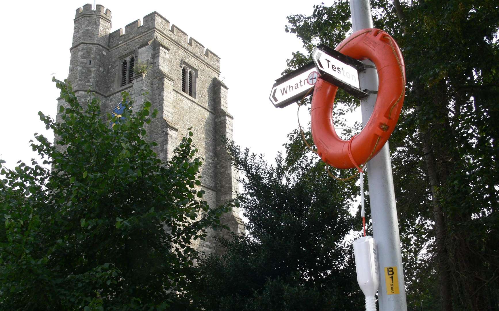 Someone felt it would be hilarious to throw a buoy over a sign