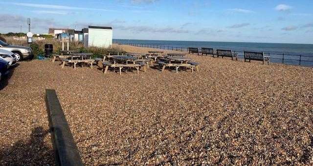 This group of picnic benches are here for the use of customers and a moment or two later they were taken by several hardy swimmers preparing to take the plunge