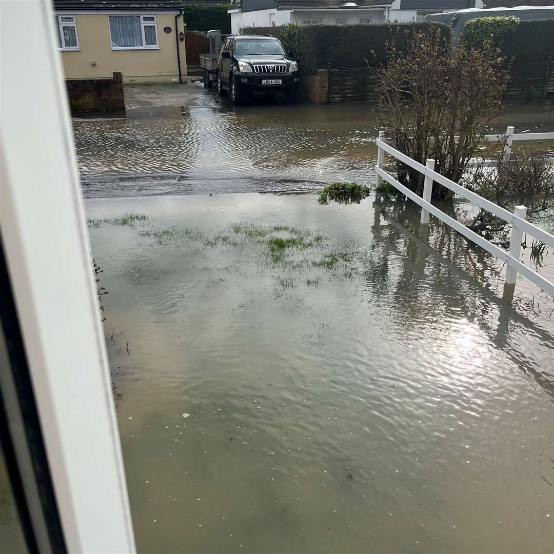 Water from the Royal Military Canal flooded Romney Way and Maureen Adaway's drive