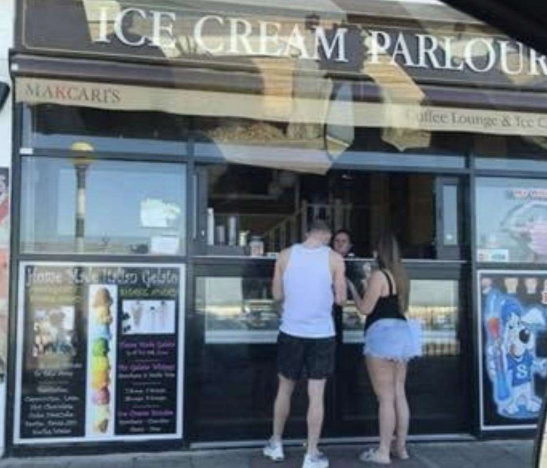 Customers photographed at the ice cream counter window on Sunday