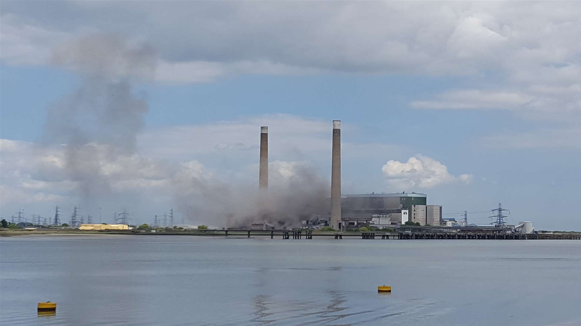 Smoke from the explosion drifts across the River Thames