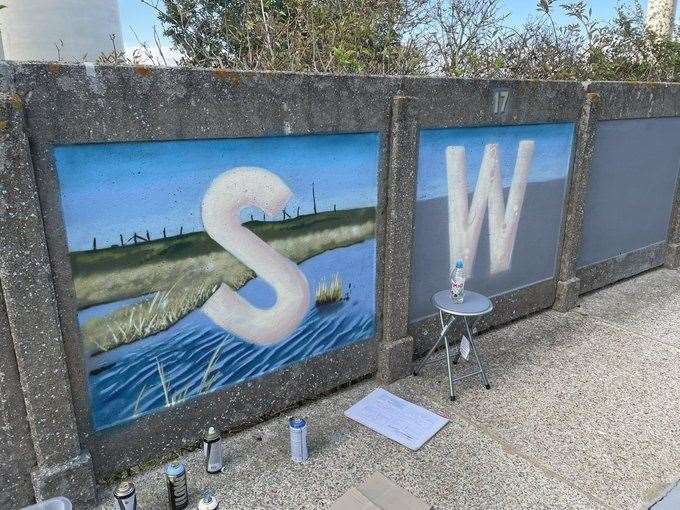 Work in progresss at Swale Halt's platform mural by Graham Upton. Picture: Kent Community Rail Partnership