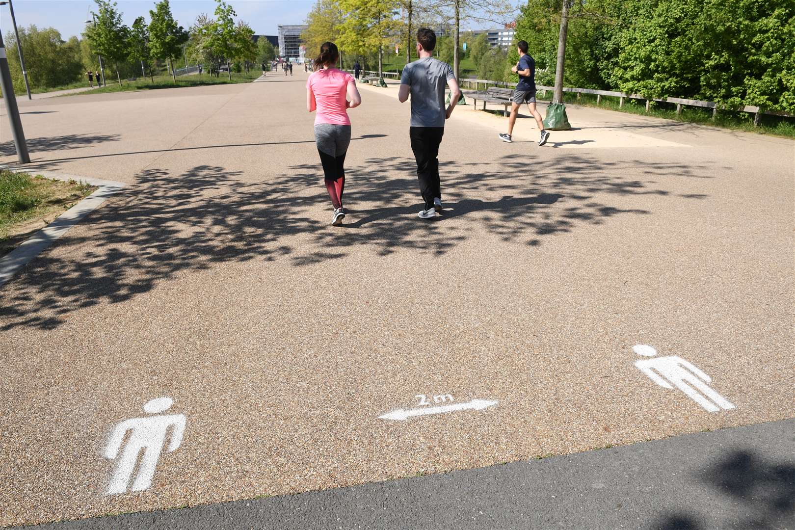 People exercising in Queen Elizabeth Olympic Park, east London (Stefan Rousseau/PA)