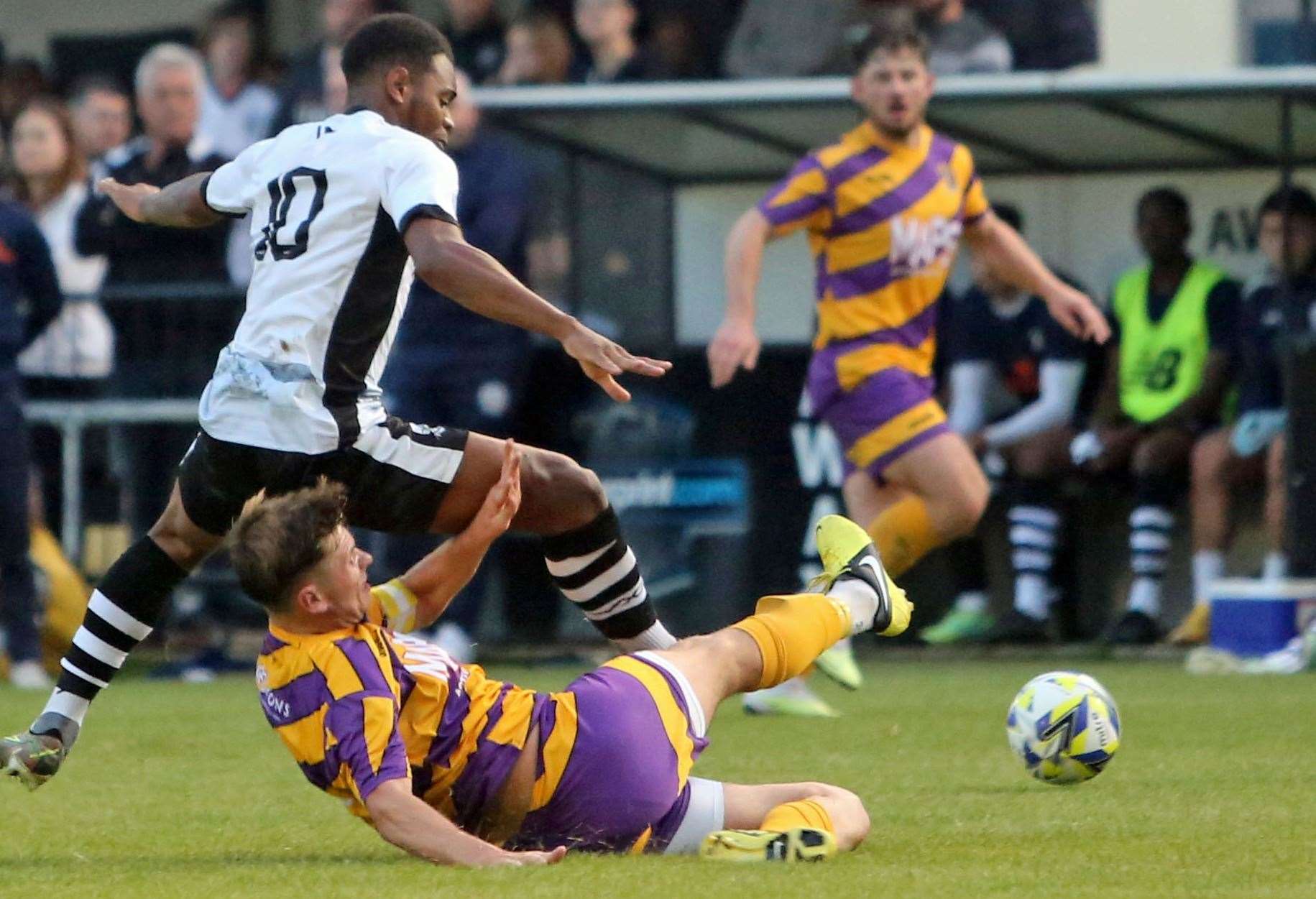 A Dover trialist is tackled by Deal's Alfie Foster. Picture: Paul Willmott