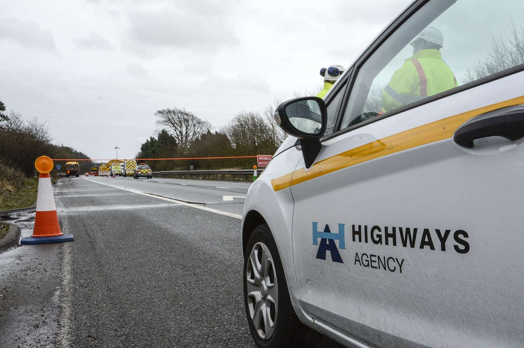 Highways Agency workers at the site. Picture: Simon Burchett