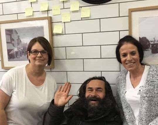 Roger, a man who makes use of the service, with staff at Barming Fish and Chip shop