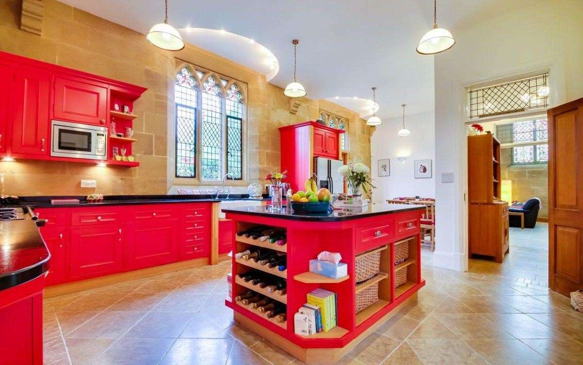 The large kitchen has a central island that can be used as a breakfast bar and wine shelf. Picture: Graham John