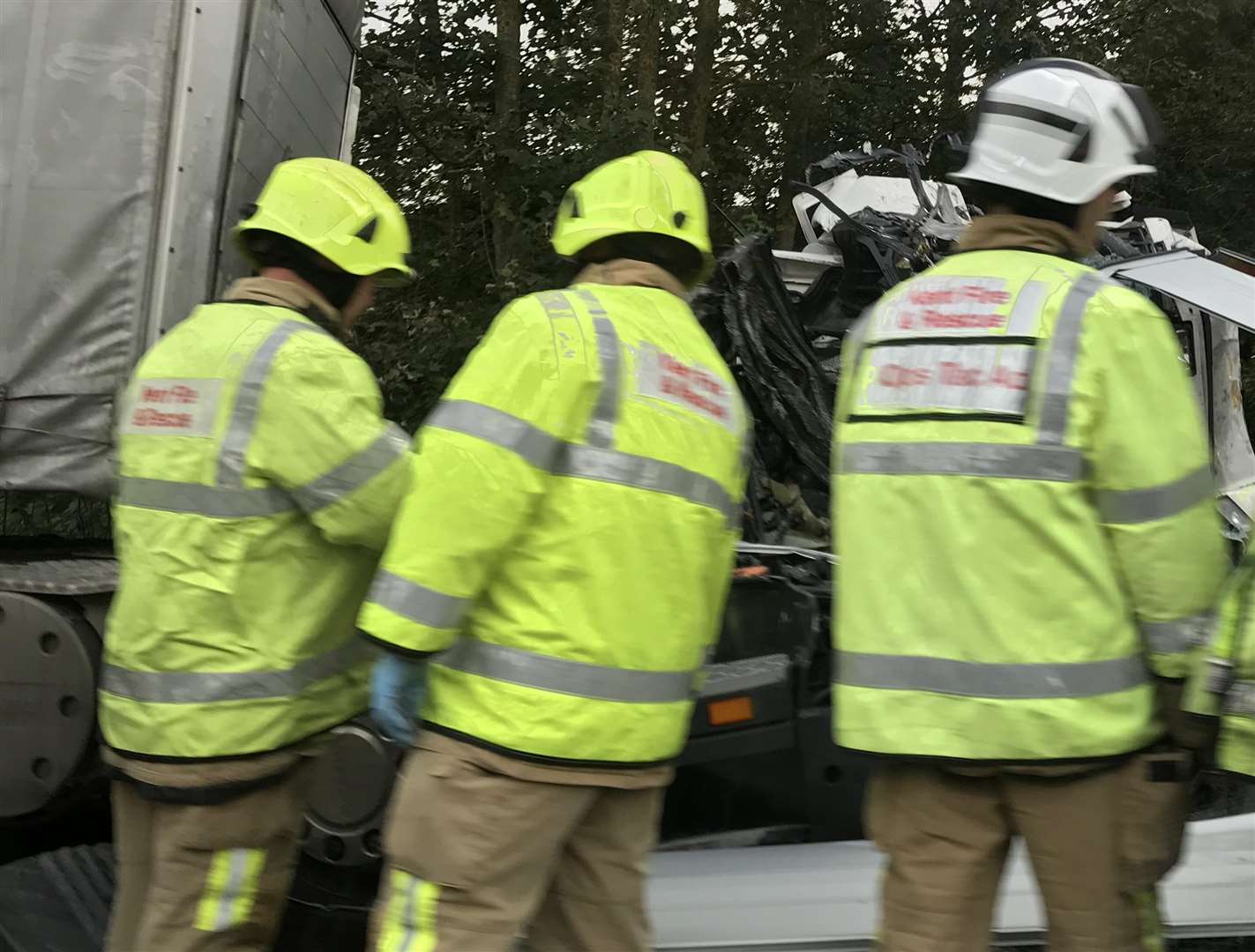 Firefighters dealing with the wreckage