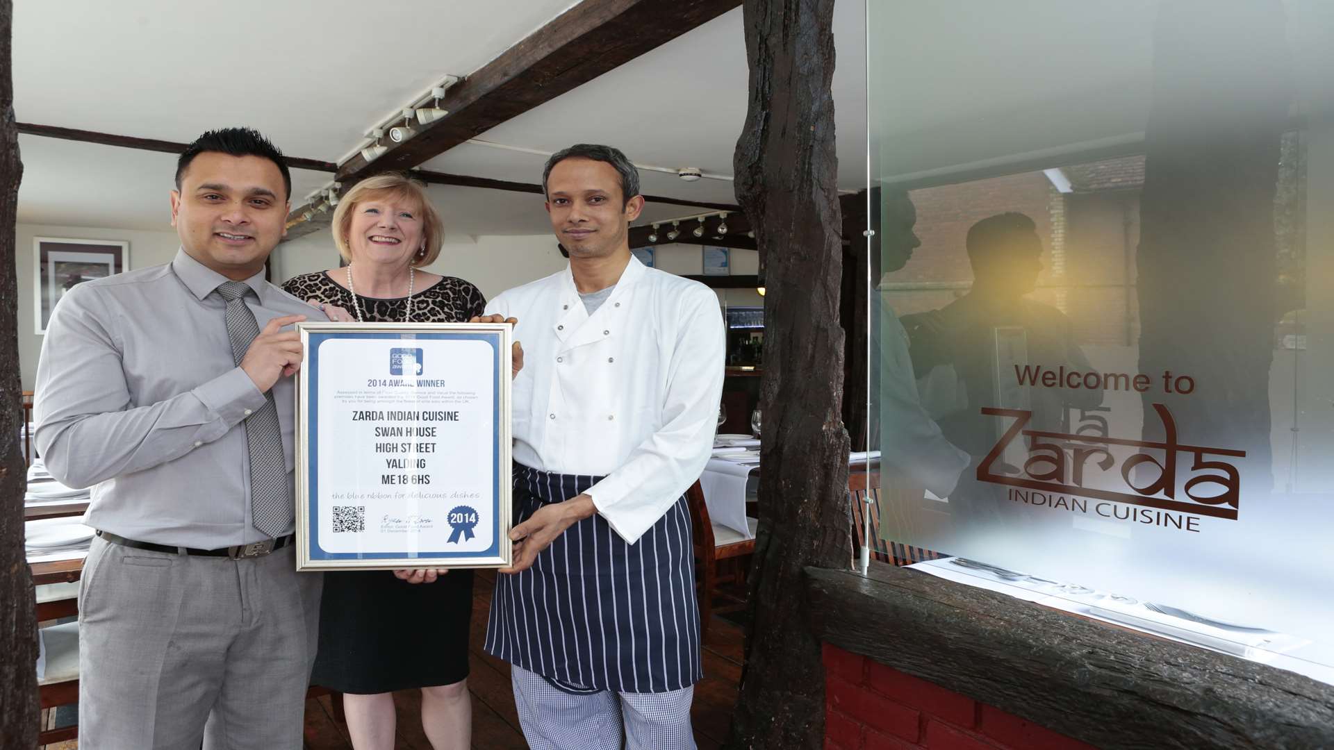 From left, Kajol Miah, Cllr Gearldine Brown, chairman of Yalding Parish Council, and chef Babul Miah