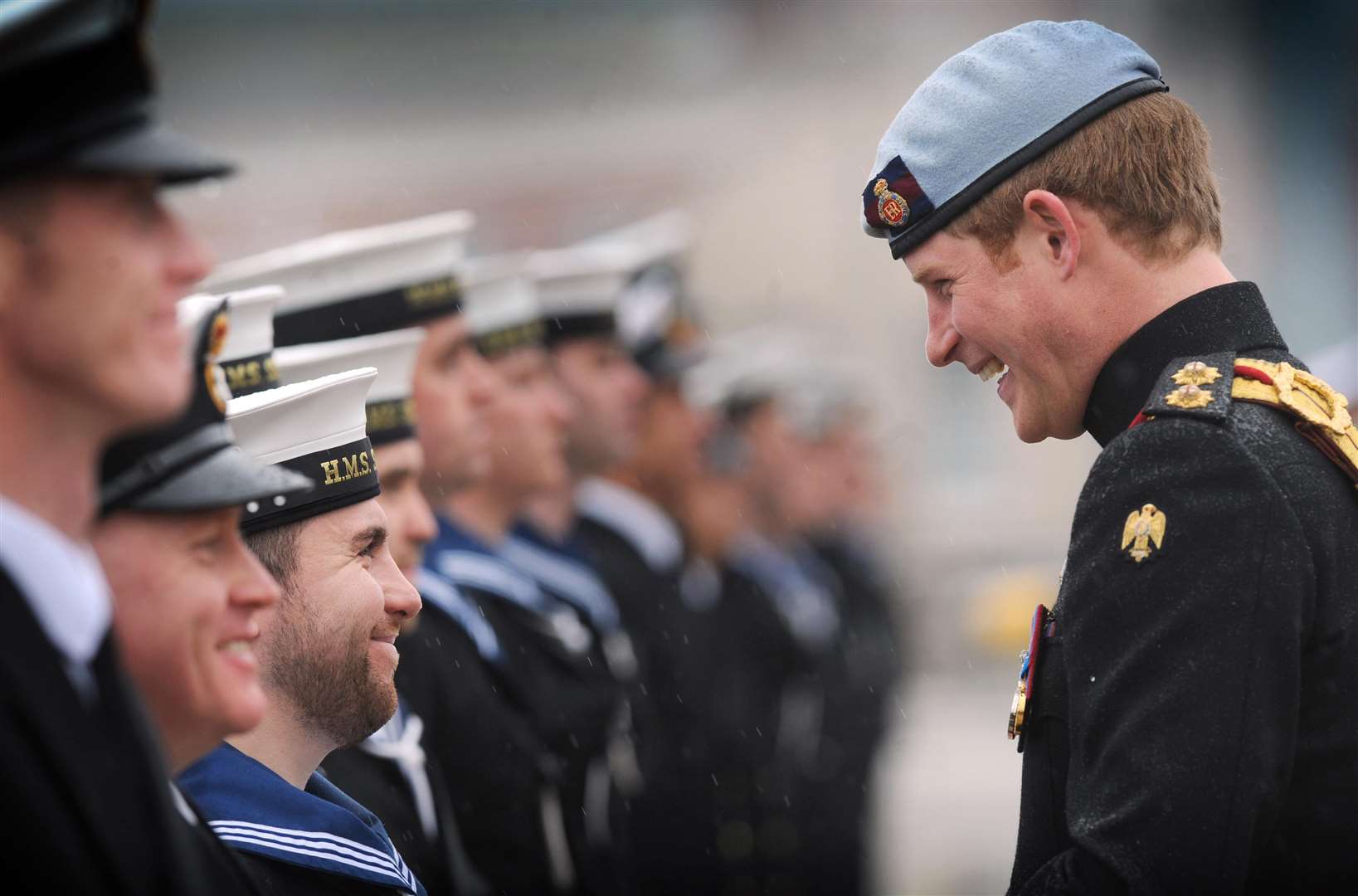 Harry meeting armed forces personnel in 2011 (Stefan Rousseau/PA)