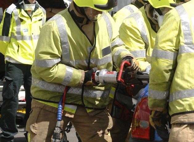 Firefighters used hydraulic cutting equipment to remove a door and rescue two casualties. Stock picture