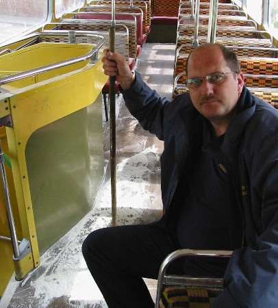 Driver Barry Poynter on the school bus covered in flour