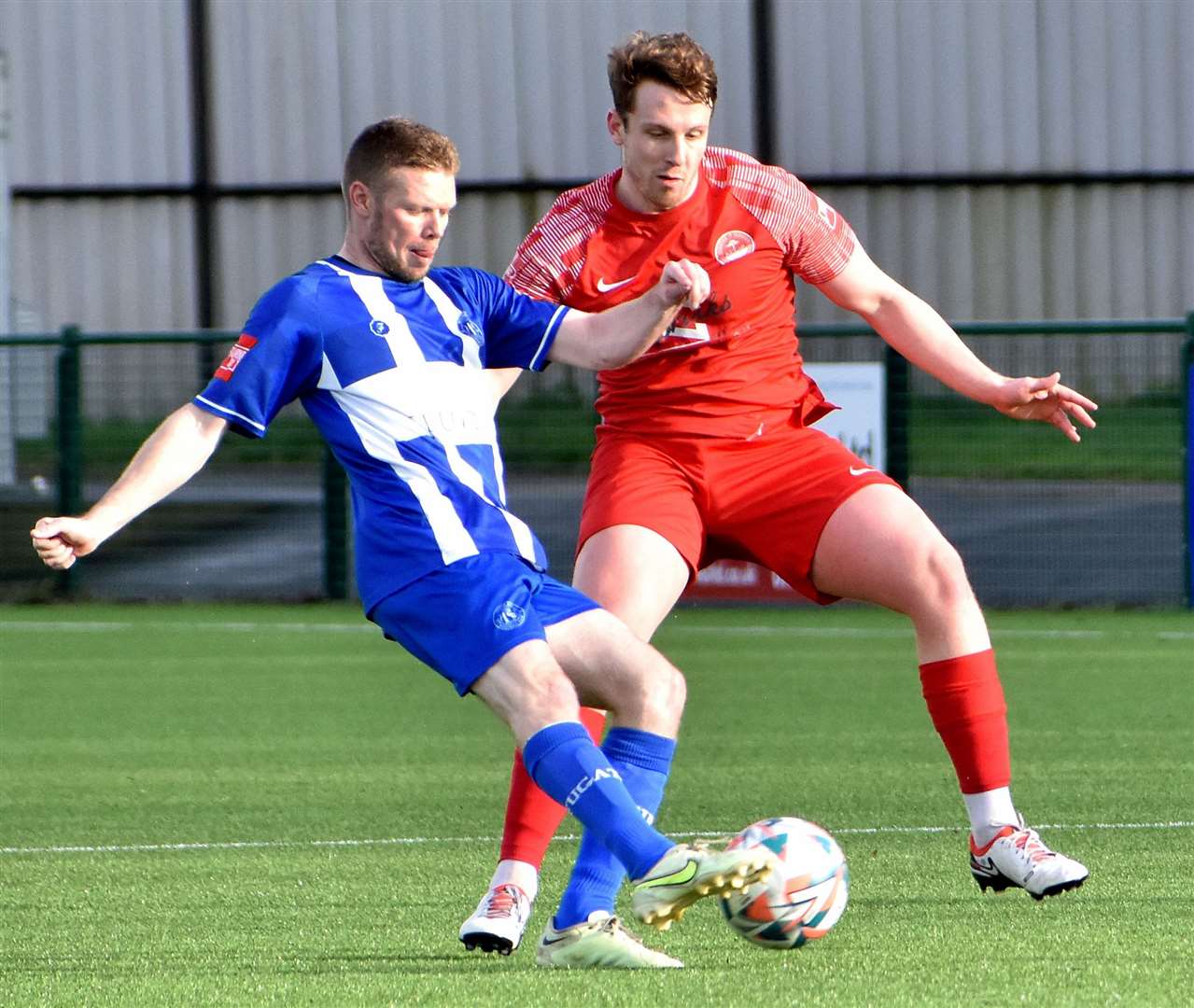 Herne Bay's Scott Heard up against Hythe's Josh Wisson in midfield. Picture: Randolph File